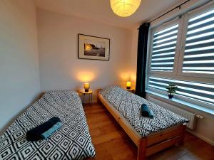 Posezení v ubytování Apartament Bazylek, miejsce parkingowe w garażu podziemnym