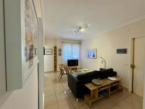 Televiisor ja/või meelelahutuskeskus majutusasutuses Mesa y Lopez Home