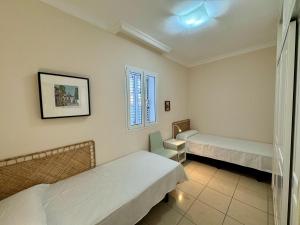 Voodi või voodid majutusasutuse Mesa y Lopez Home toas