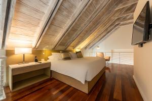 Voodi või voodid majutusasutuse Hotel Boutique Bovedas de Santa Clara By Accor toas