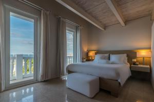Voodi või voodid majutusasutuse Hotel Boutique Bovedas de Santa Clara By Accor toas