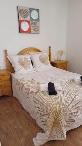 a bedroom with a large bed with two pillows at Tranquilo Townhouse Casa Spain Kwintos in Torrevieja +66 photos