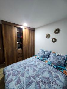 Postel nebo postele na pokoji v ubytování Amoblado Norte oncológico CTIC