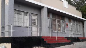 a building with a fence on the side of it at BDC Paarl Accommodation and Guest House in Paarl