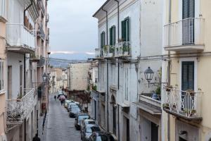 a city street with buildings and cars parked on the street at CasaMilla in Campobasso