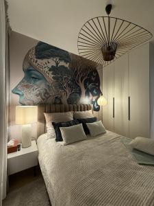 a bedroom with a large mural on the wall at Apartament Pod Żaglami 2 in Sława