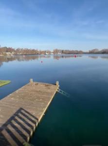 a dock in the middle of a body of water at Lakeside Retreat - AGH Hot Tub Breaks - Tattershall Lakes in Tattershall +4 photos