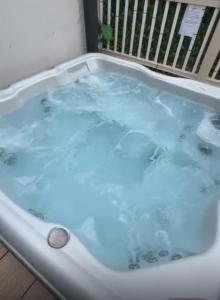 a jacuzzi tub in a room at Lakeside Retreat - AGH Hot Tub Breaks - Tattershall Lakes in Tattershall