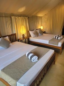 Uma cama ou camas num quarto em Trickling Stream Campsite
