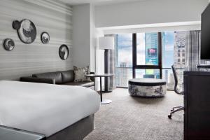 a living room with a couch and a table at New York Marriott Marquis in New York