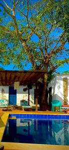 a house with a tree and a swimming pool at HOTEL RENASCI PALOMINO in Palomino +35 photos