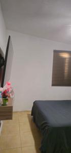 a bedroom with a bed and a table with a lamp at Habitacion in Monterrey