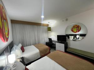 Postel nebo postele na pokoji v ubytování Hotel México Plaza Irapuato