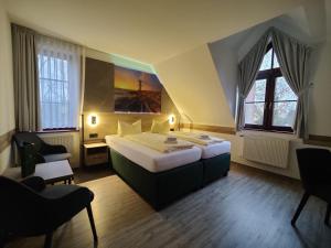 Postel nebo postele na pokoji v ubytování Hotel Stettiner Hof