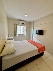 a bedroom with a large bed and a window at Desativado in São Luís +30 photos