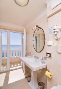 a bathroom with a sink and a large window at Apartments and Room Luxury dream in Brela +56 photos