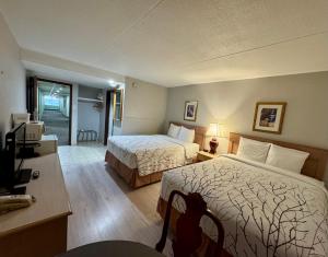 Postel nebo postele na pokoji v ubytování Best Stay Inn