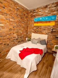 Ένα ή περισσότερα κρεβάτια σε δωμάτιο στο Fitzroy- boho #GuestHouse 2km CBD