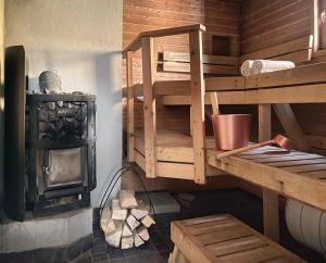 a kitchen with a wood stove in a room at Houses by The Sea in Salpar