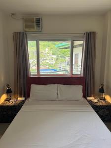 Postel nebo postele na pokoji v ubytování Lakandiwa Tourist Inn