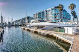 a boat docked at a dock in a marina at Venice Marina Water Front Luxury Condo in Los Angeles