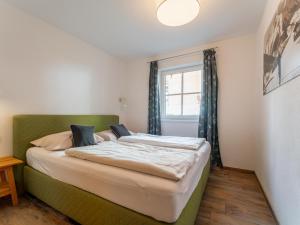 Posteľ alebo postele v izbe v ubytovaní Tauern Suites Mitterwirt TOP 214