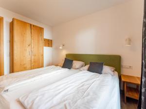 Posteľ alebo postele v izbe v ubytovaní Tauern Suites Mitterwirt TOP 214