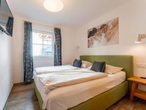 Posteľ alebo postele v izbe v ubytovaní Tauern Suites Mitterwirt TOP 214