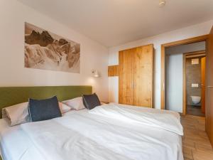 Posteľ alebo postele v izbe v ubytovaní Tauern Suites Mitterwirt TOP 214