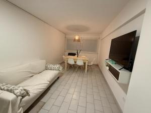 a living room with a couch and a table at Departamento impecable! in Azul