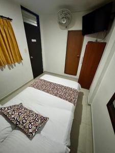 Rúm í herbergi á Hotel Tucan Pereira