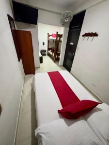 Rúm í herbergi á Hotel Tucan Pereira