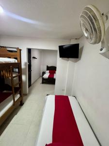 Rúm í herbergi á Hotel Tucan Pereira