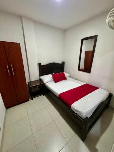 Rúm í herbergi á Hotel Tucan Pereira