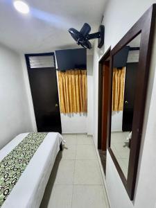 Rúm í herbergi á Hotel Tucan Pereira