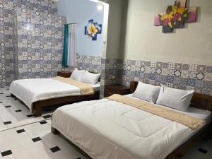 Letto o letti in una camera di ADA Homestay