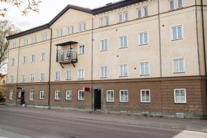 a large building on the side of a street at Anrika Svea Bed & Breakfast in Sala