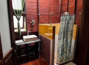 a bathroom with a sink and a shower at Panpim Resort in Ban Noen Hom