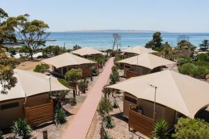 an aerial view of a resort with umbrellas at Seafront Holiday Park Kangaroo Island in Penneshaw