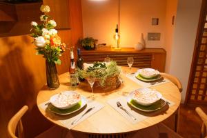 a wooden table with two plates of food on it at Sakura Residence Hakone in Hakone