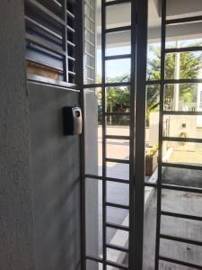 a door leading into a room with a window at Afeena Homestay Bandar Tasik Kesuma in Beranang