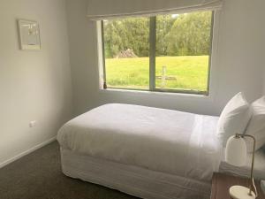 Postel nebo postele na pokoji v ubytování Tomogalak Lodge
