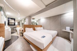 a hotel room with a bed and a bathroom at SimpleStay Hotel in Jongno in Seoul +118 photos