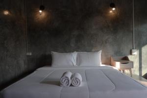 Postel nebo postele na pokoji v ubytování Baankao Resort Rayong