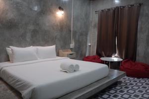 Postel nebo postele na pokoji v ubytování Baankao Resort Rayong