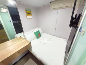 Postelja oz. postelje v sobi nastanitve Apple Hostel 蘋果賓館