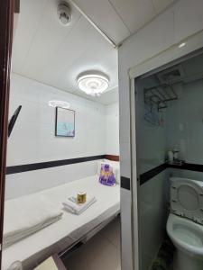 Kopalnica v nastanitvi Apple Hostel 蘋果賓館