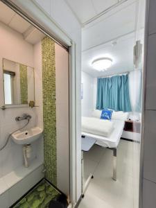 Kopalnica v nastanitvi Apple Hostel 蘋果賓館
