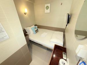 Postelja oz. postelje v sobi nastanitve Apple Hostel 蘋果賓館
