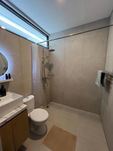 a bathroom with a toilet and a shower and a sink at Villa Tres Adam in Canggu +12 photos